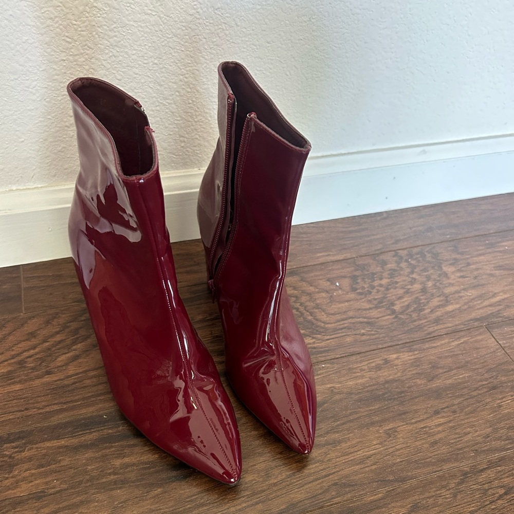 Red patent leather zip heeled boots